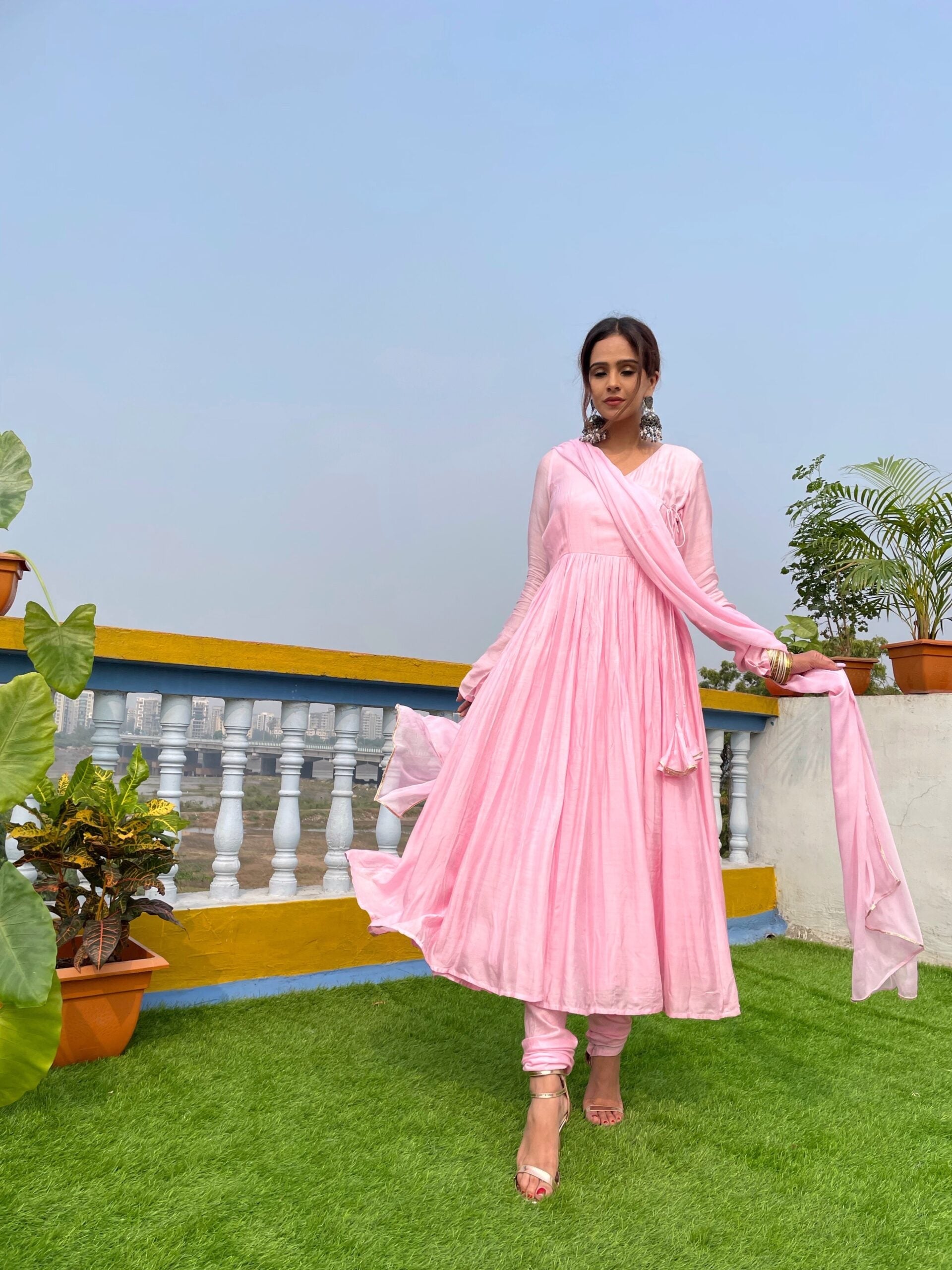 Elegant taffy pink anarkali suit set with intricate design, perfect for festive occasions