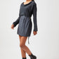 Stylera Tate cowl neck dress in black with long sleeves and belt worn with black boots