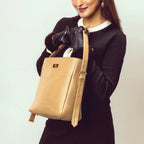 Stylish taupe bucket bag for women with a sleek design and adjustable strap by Stylera