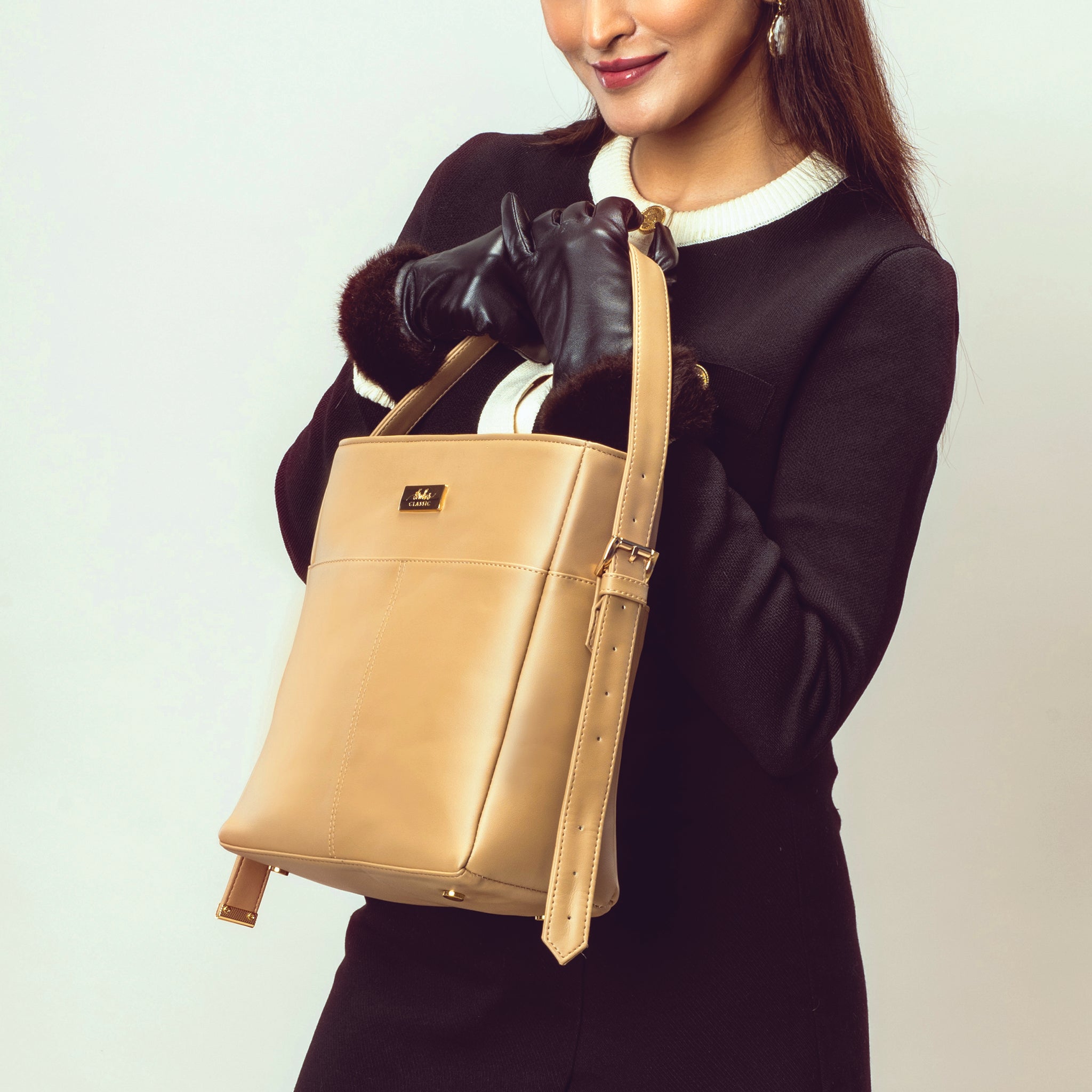 Stylish taupe bucket bag for women with a sleek design and adjustable strap by Stylera