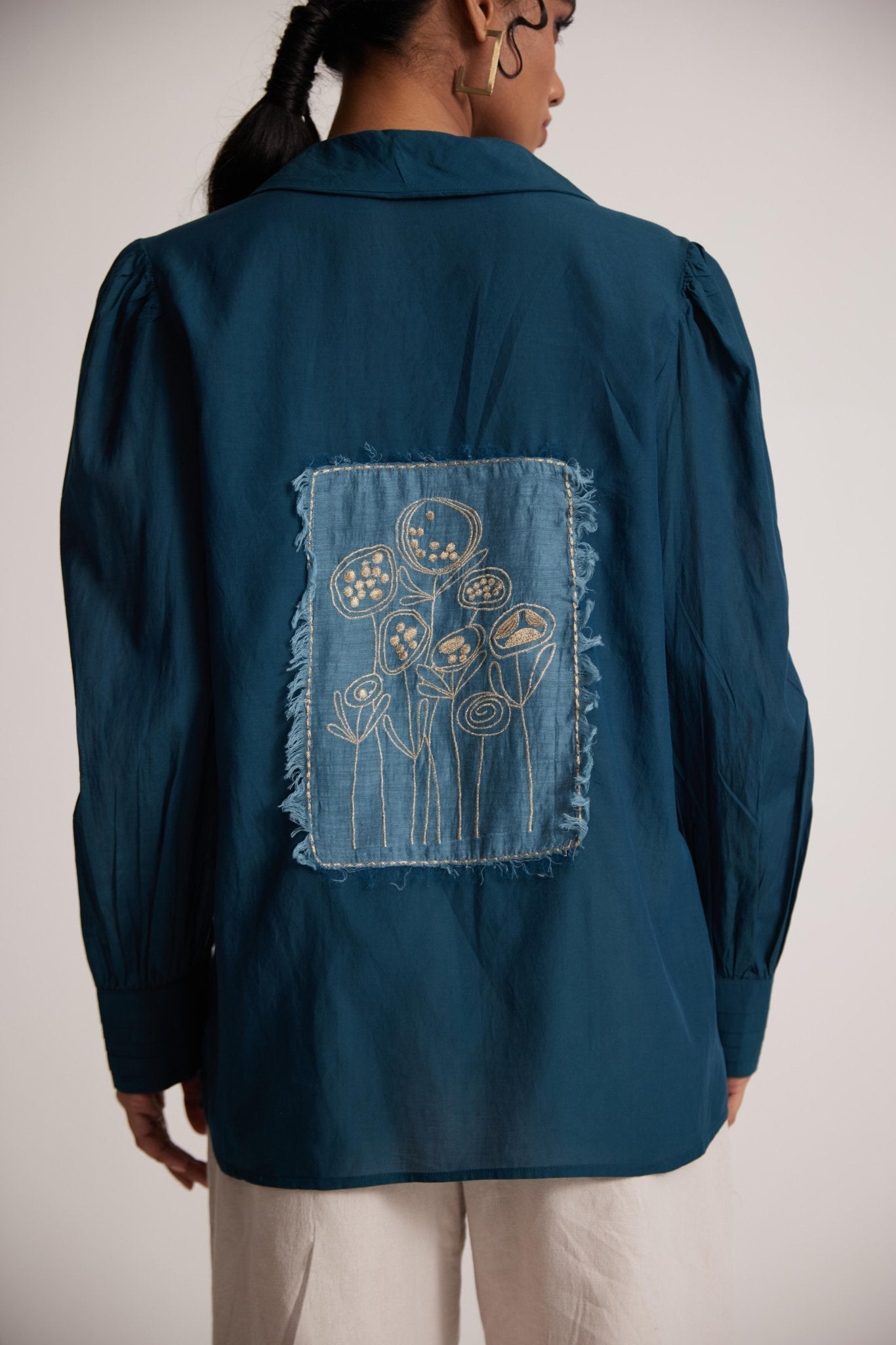 Teal cotton shirt for women with floral embroidery patch on the back by Stylera