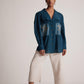 Stylera teal cotton shirt for women with embroidery and button front worn by model
