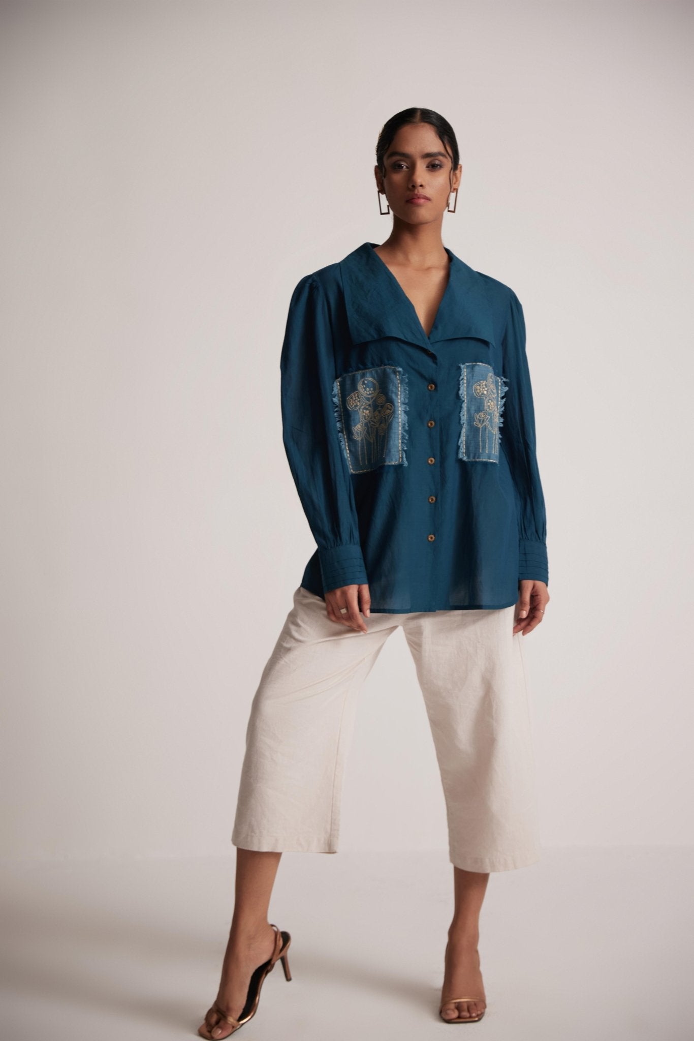 Stylera teal cotton shirt for women with embroidery and button front worn by model