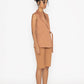 Stylera terra color fashion vest worn by model with matching shorts and brown slip-on shoes