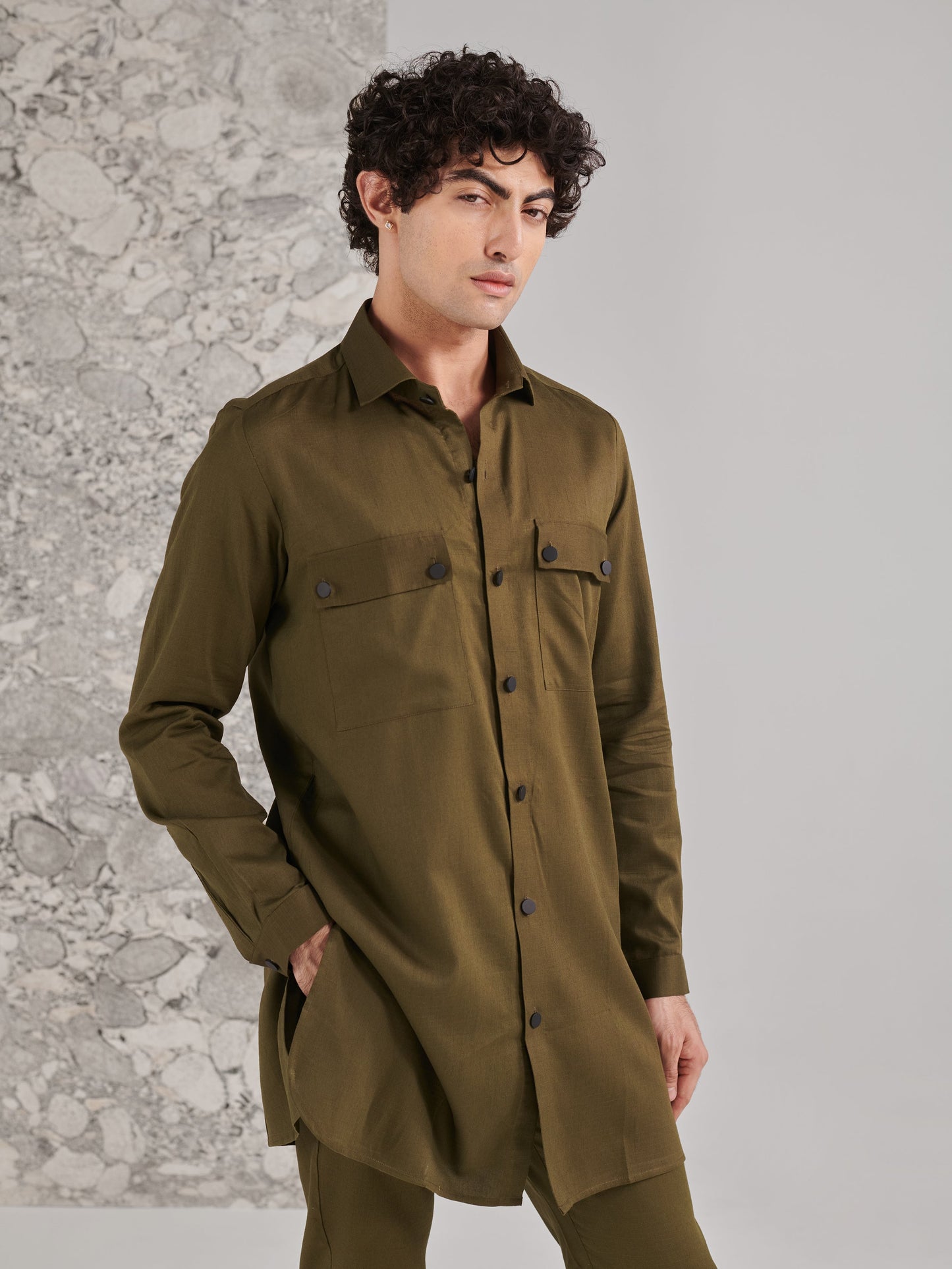 Stylish traditional green kurta pajama from Stylera, featuring button-up details and a relaxed fit