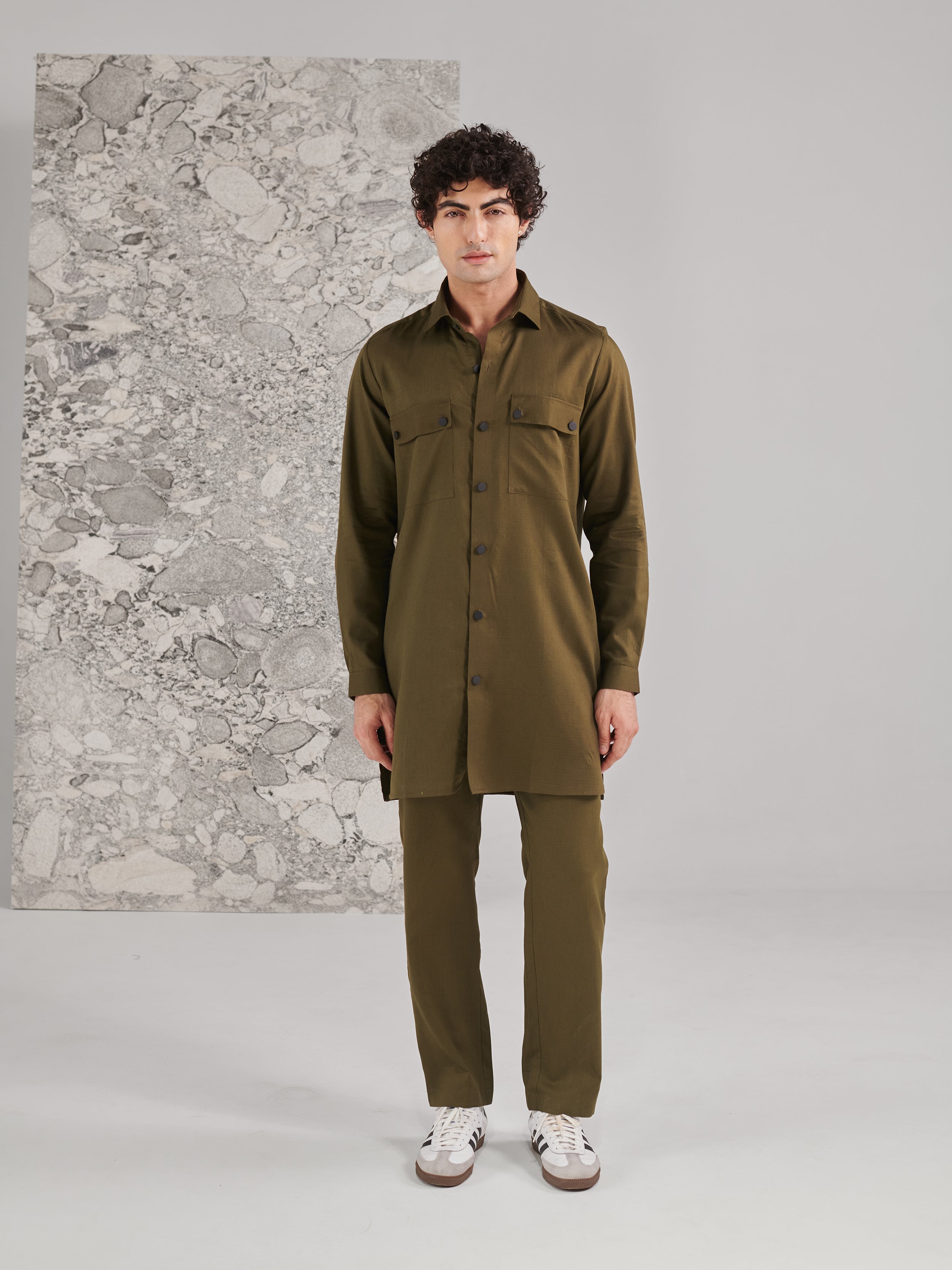 Men's traditional green kurta pajama set in a classic style perfect for festive occasions