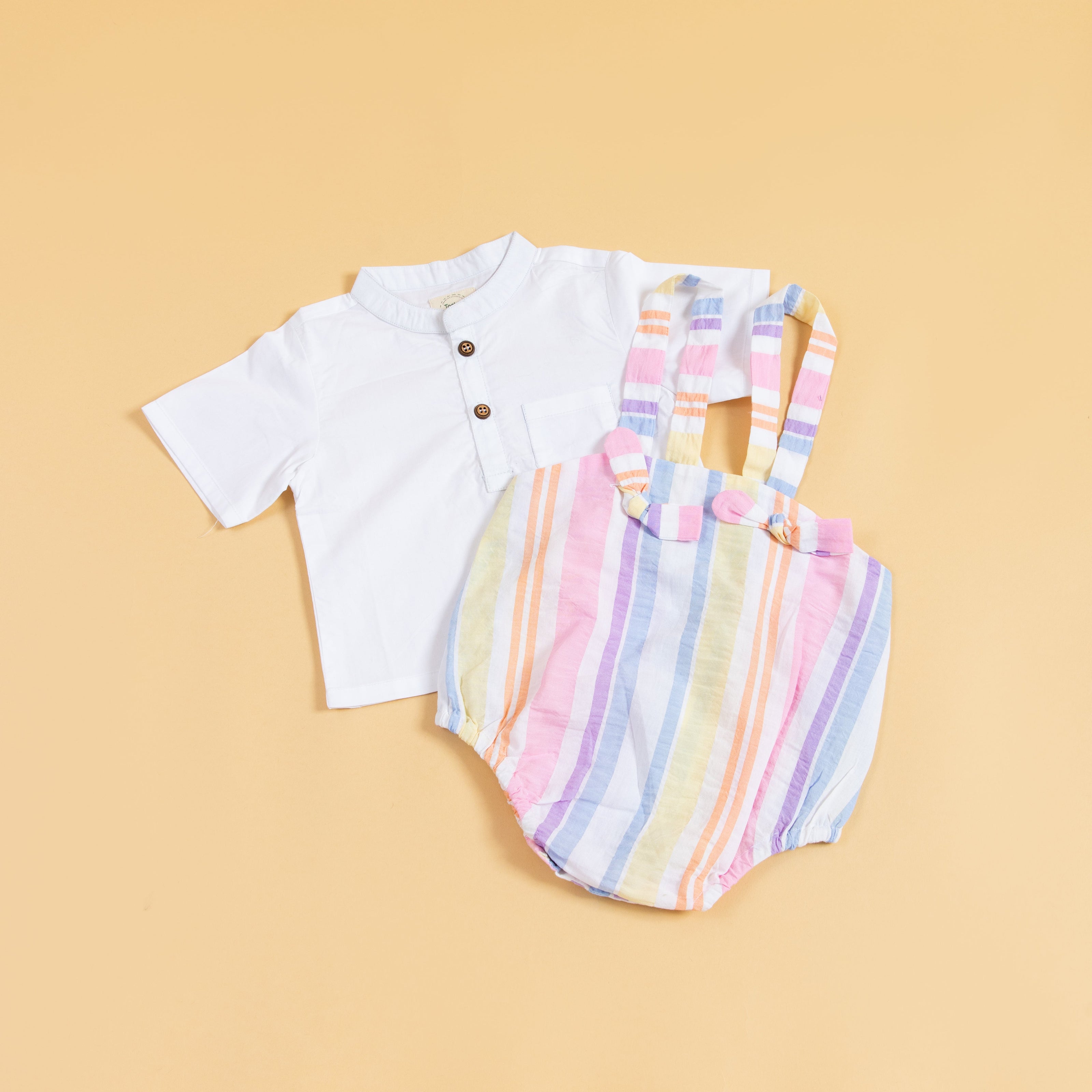 Trendy baby clothes set featuring a white shirt and colorful striped romper for stylish infants