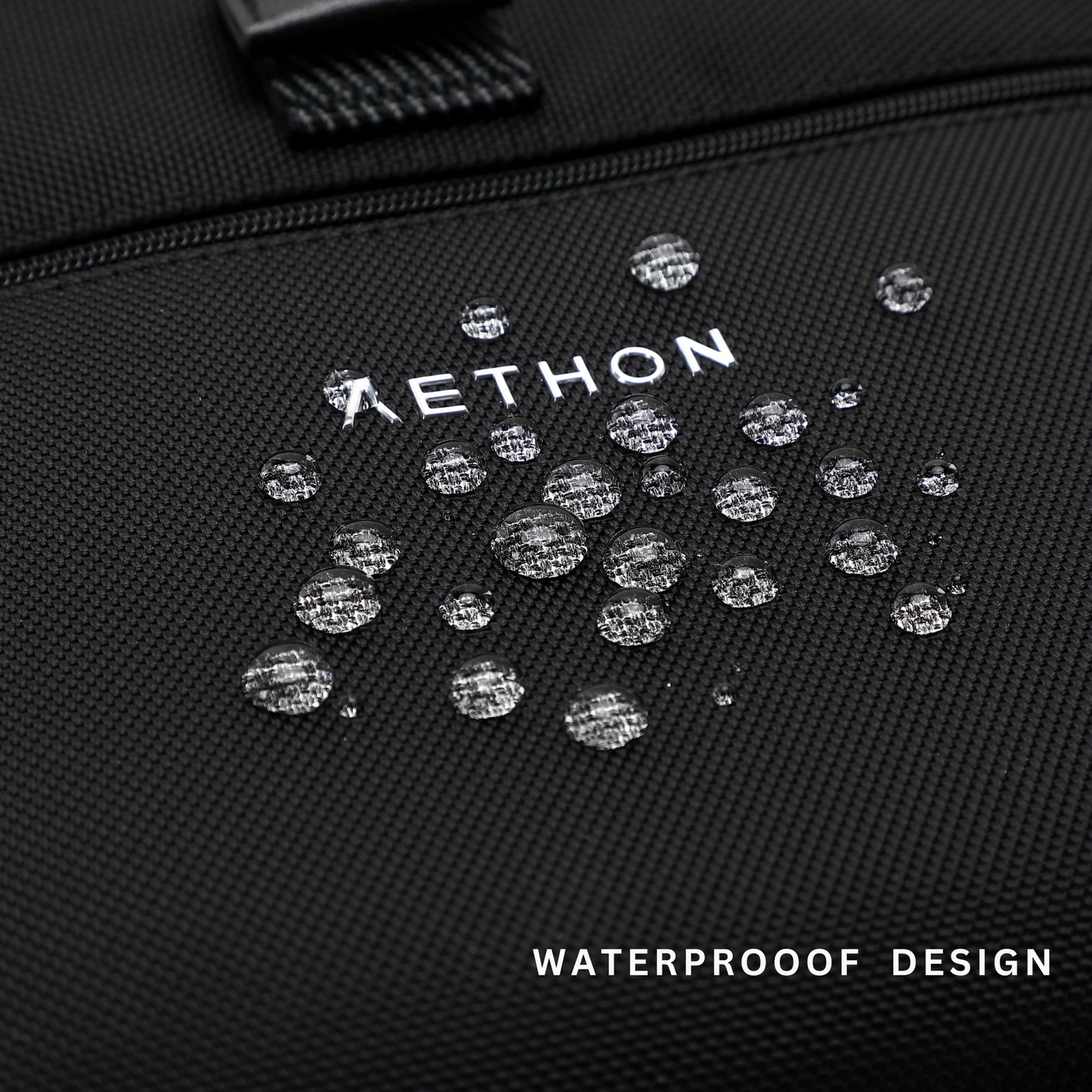 Stylera trendy black travel backpack close up showing waterproof textured fabric and water droplets on logo