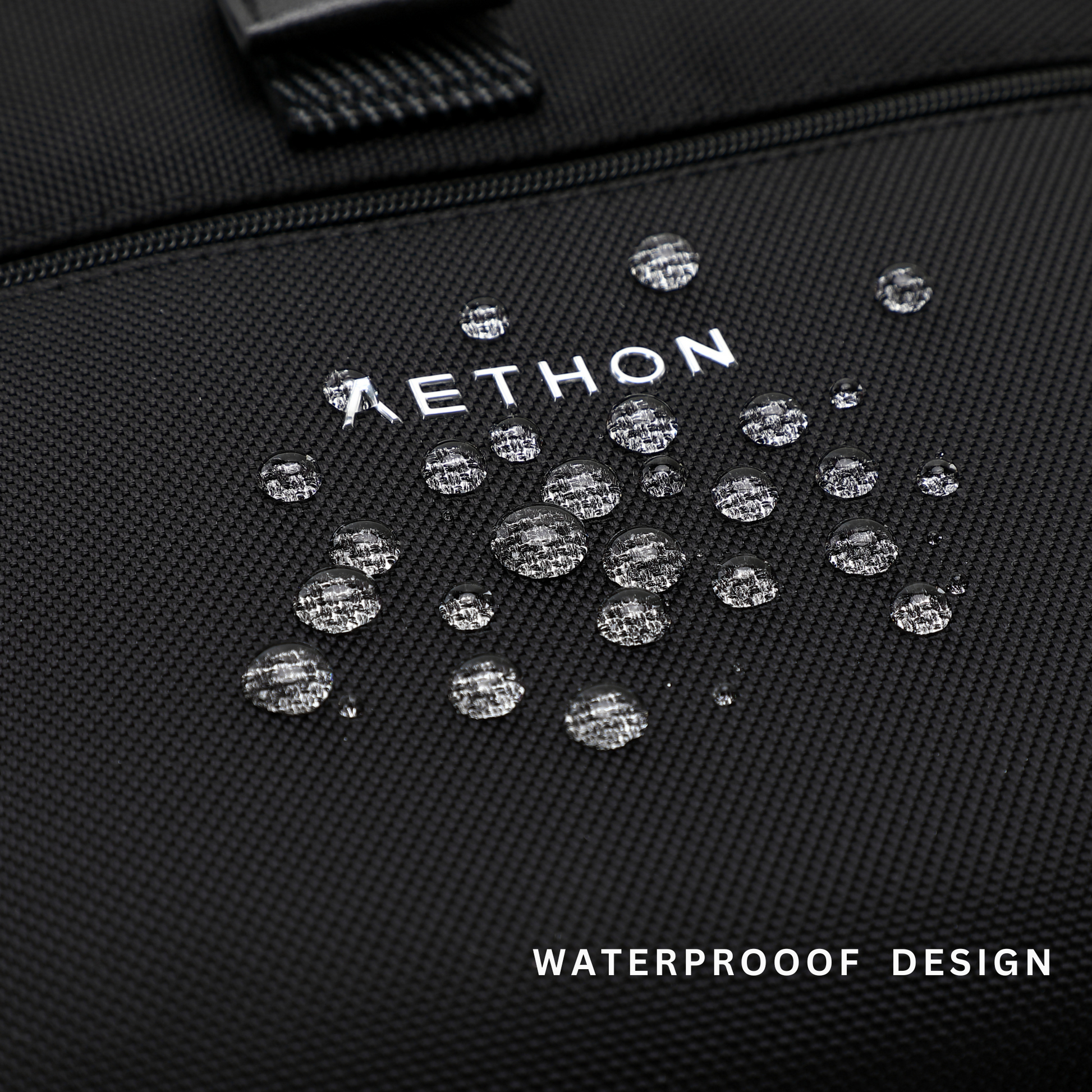 Stylera trendy black travel backpack close up showing waterproof textured fabric and water droplets on logo