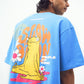Model wearing Stylera trendy blue t-shirt for men and women with large back meditating frog and flowers