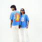 Two models wearing Stylera trendy blue t-shirt for men and women with graphic back print and white pants