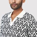 Stylish knit polo shirt for men featuring a bold geometric pattern, perfect as a trendy casual polo for men.