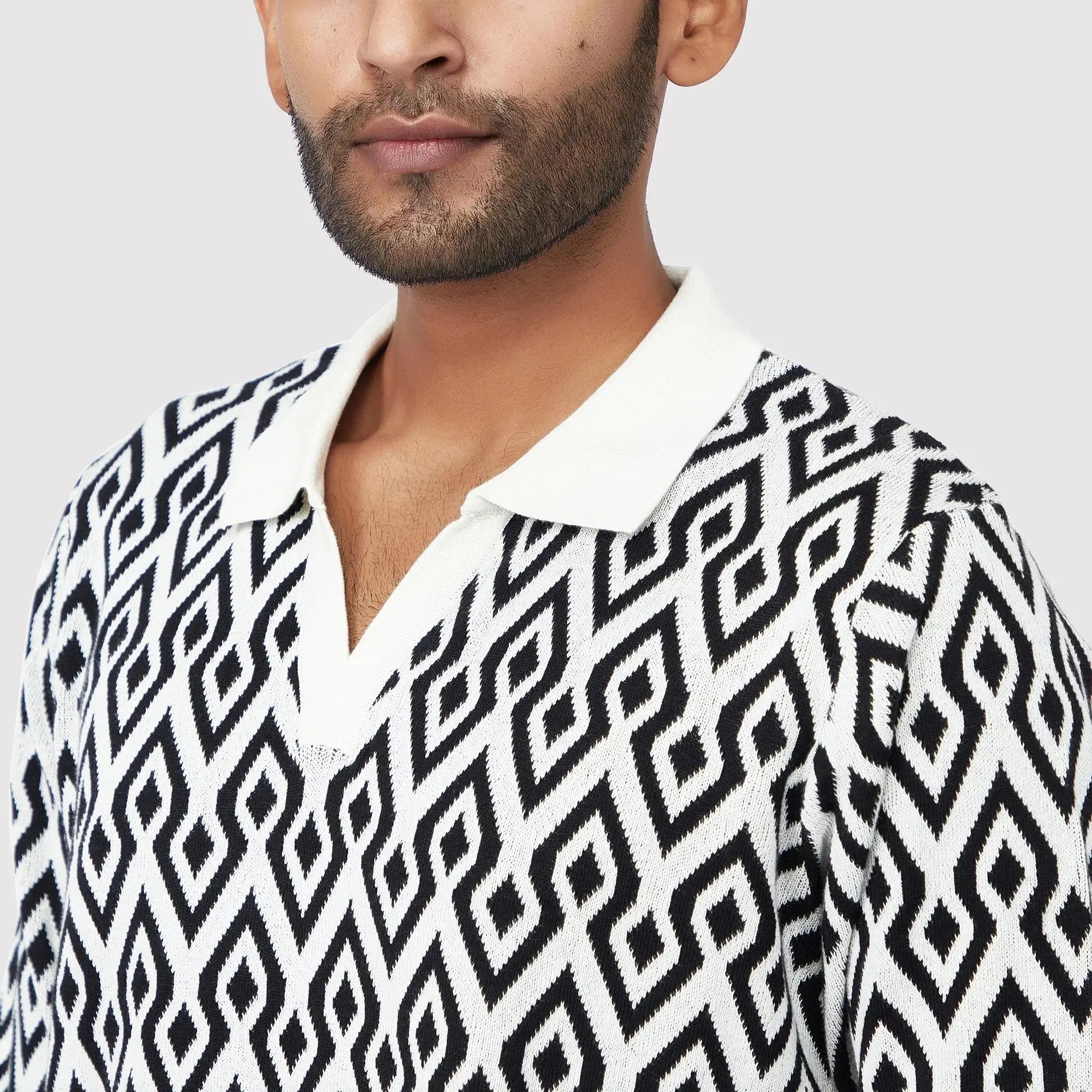 Stylish knit polo shirt for men featuring a bold geometric pattern, perfect as a trendy casual polo for men.