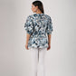 Back view of a stylish Stylera trendy casual tops for women featuring a vibrant floral design and puff sleeves