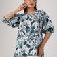 Trendy casual tops for women featuring a floral design and puff sleeves in light colors