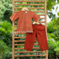 Trendy children's ethnic outfits featuring a rust-colored top and matching pants, perfect for festive occasions