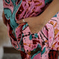 Trendy cotton two piece outfit in vibrant floral print with stylish pockets and relaxed fit