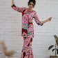Model wearing a trendy cotton two piece outfit featuring vibrant colors and bold patterns