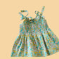 Trendy cyan casual dress with floral pattern and bow tie straps for a playful summer look