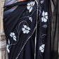 Elegant model wearing a trendy elegant party wear saree with floral embroidery and decorative borders
