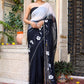 Trendy elegant party wear saree in black with floral design and embellished border for festive occasions