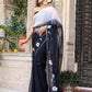 Trendy elegant party wear saree in black with white floral design, perfect for festive occasions