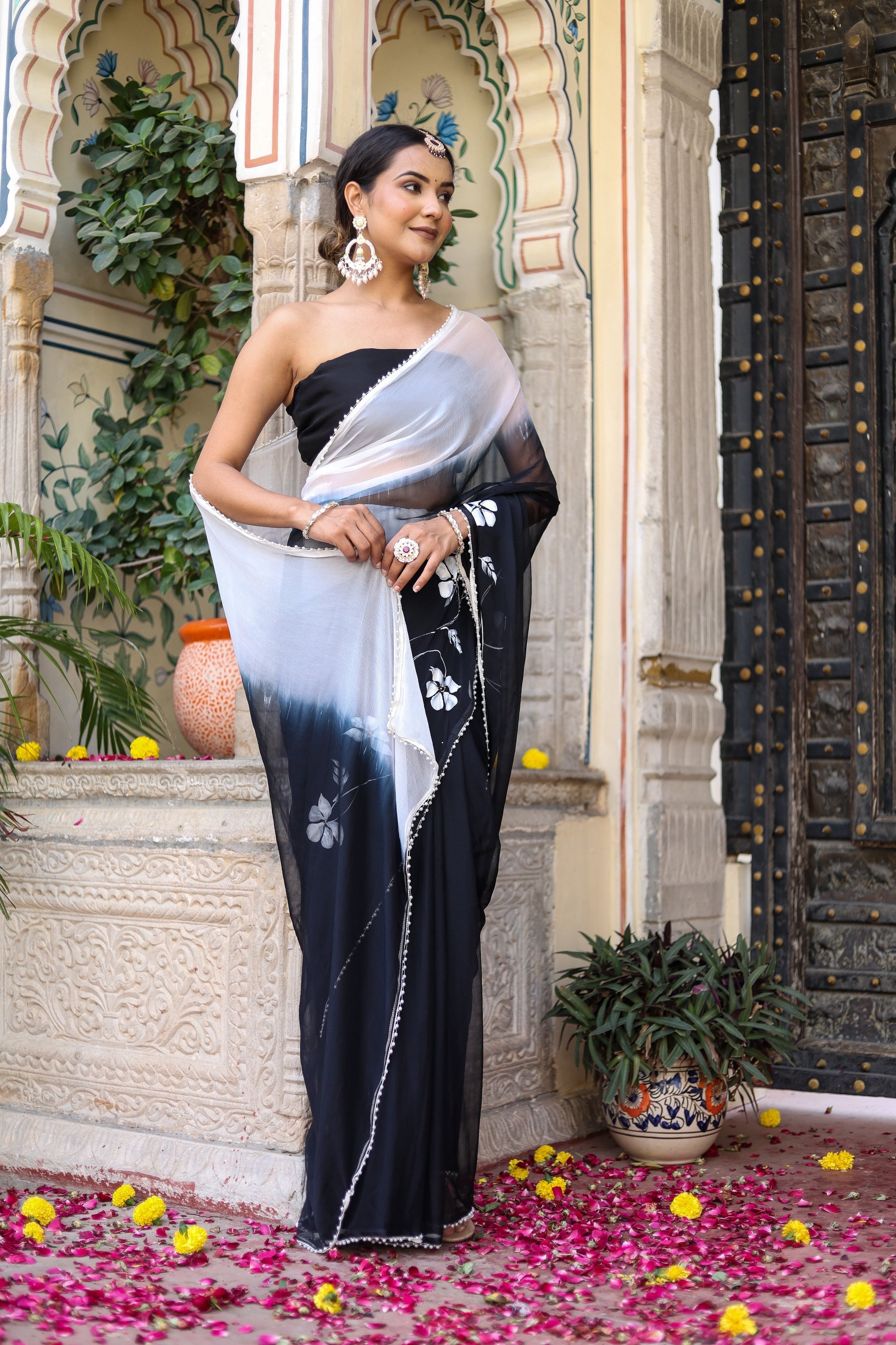 Trendy elegant party wear saree in black with a stylish gradient and detailed embroidery