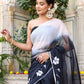 Trendy elegant party wear saree in black with floral embroidery, styled with matching accessories