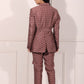 Back view of a trendy ethnic blazer pant set in a stylish pattern with a tailored fit
