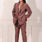Stylish woman wearing a trendy ethnic blazer pant set in a unique pattern for sophisticated occasions