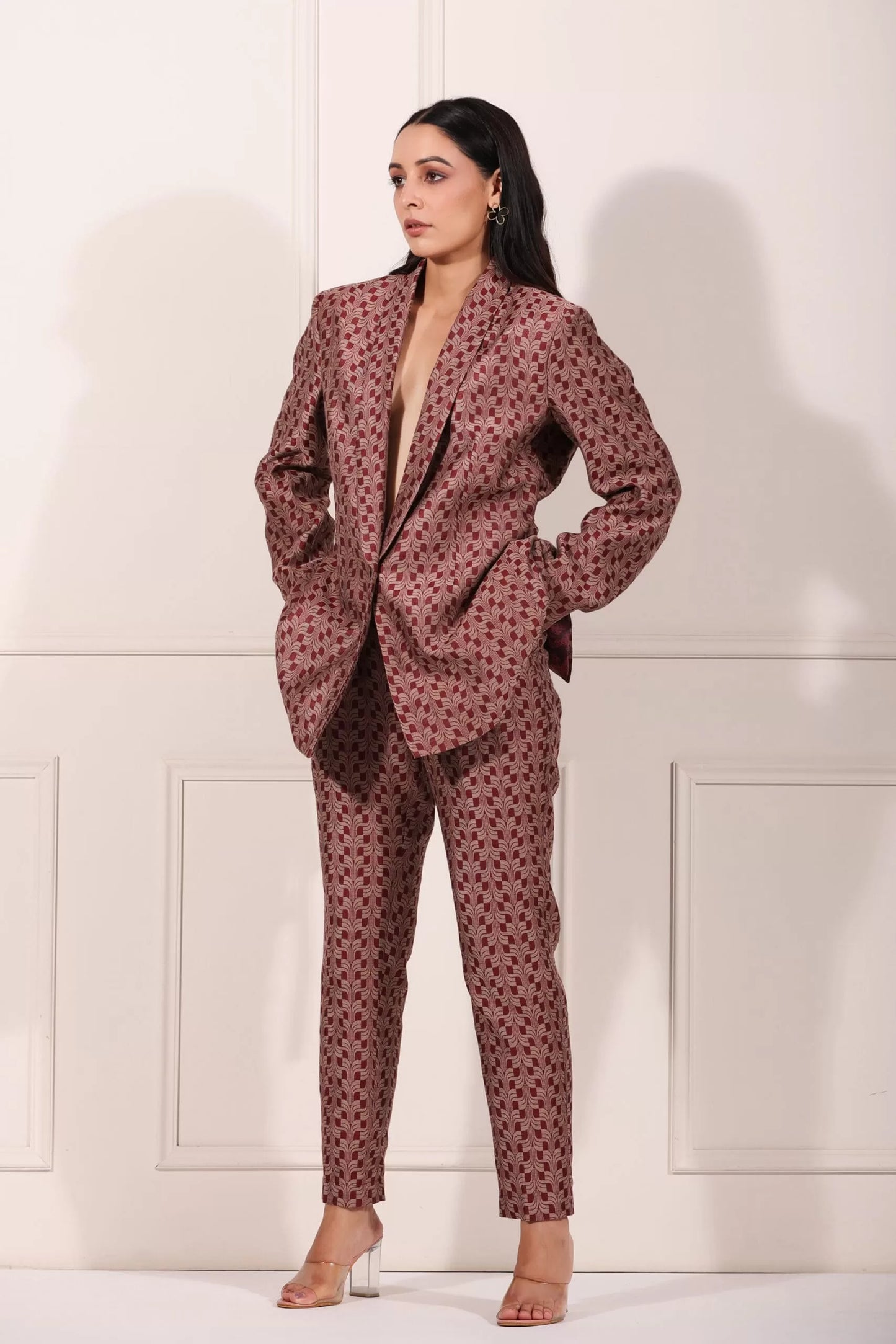 Stylish woman wearing a trendy ethnic blazer pant set in a unique pattern for sophisticated occasions