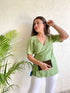 Green Wrap Top, perfect trendy ethnic wear for summer, styled with white pants and a clutch.