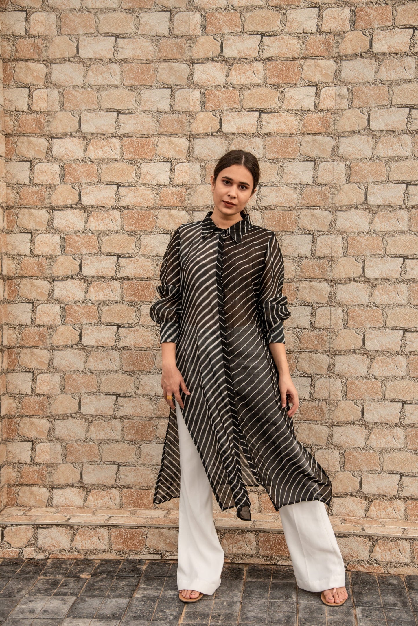Trendy ethnic wear for women featuring a striped black and white long kurta paired with white pants