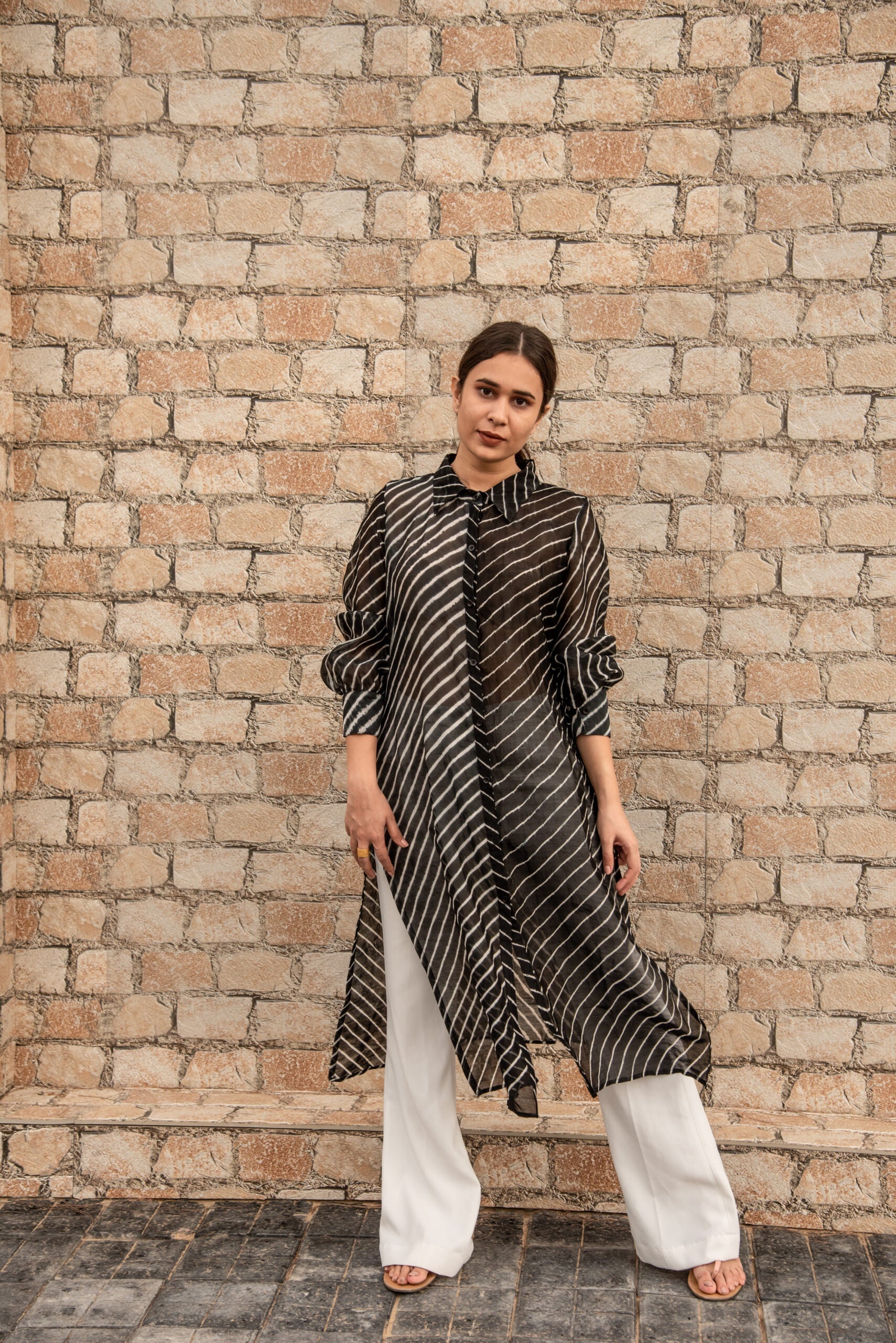 Trendy ethnic wear for women featuring a striped black and white long kurta paired with white pants
