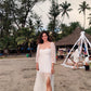 Stylera trendy evening maxi dress with sheer sleeves and leg slit, perfect for beach outings