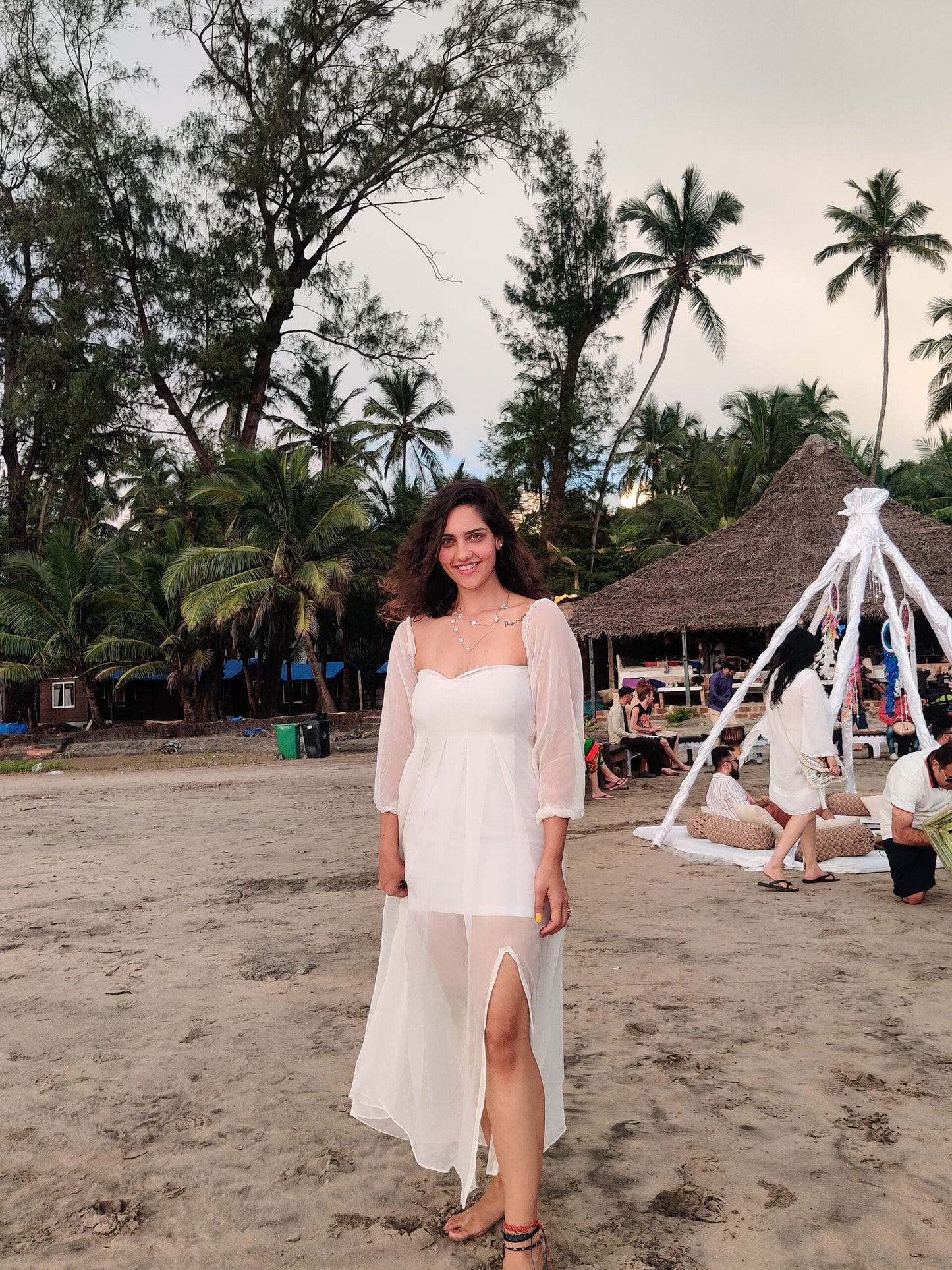 Stylera trendy evening maxi dress with sheer sleeves and leg slit, perfect for beach outings
