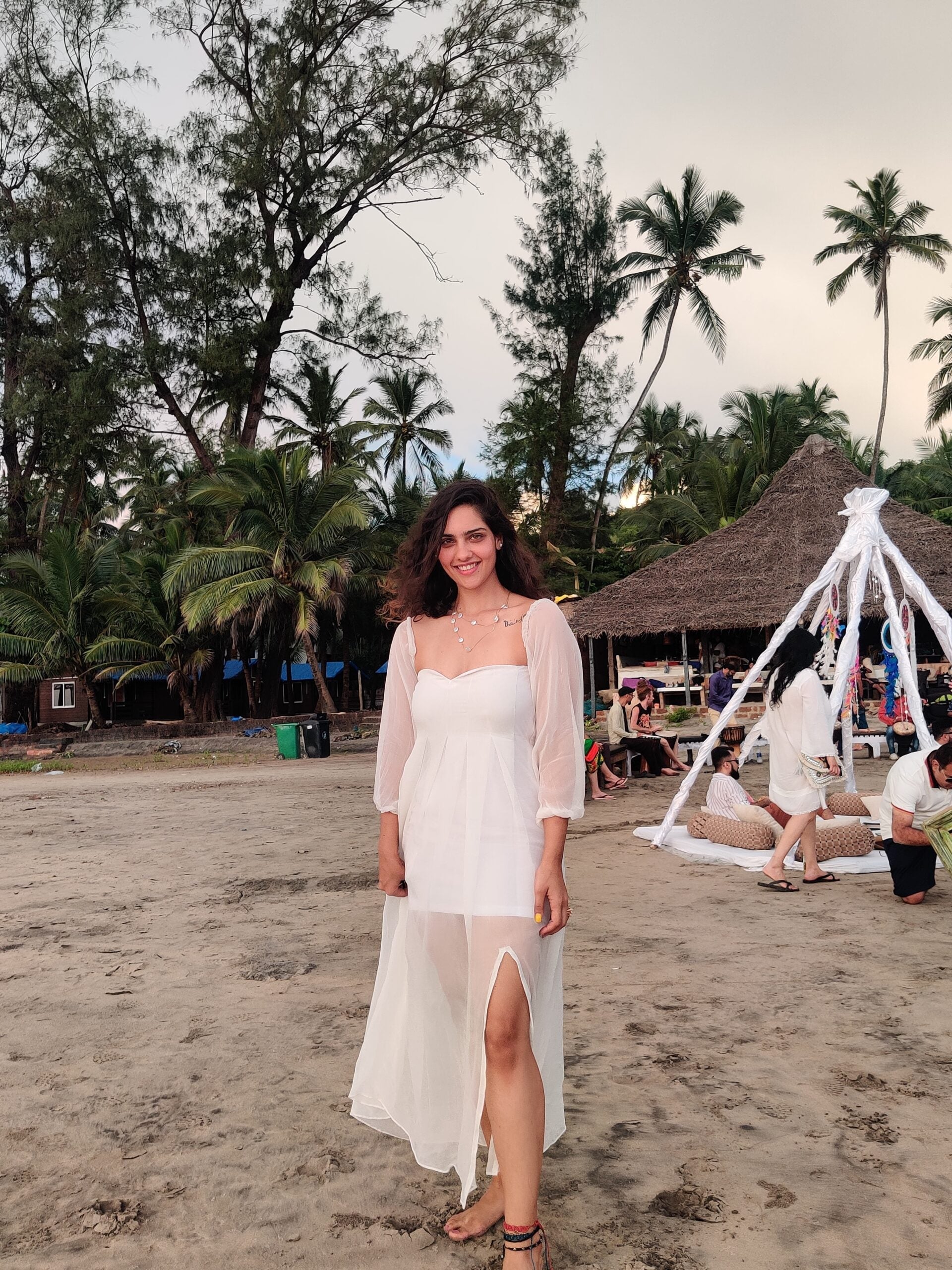 Stylera trendy evening maxi dress with sheer sleeves and leg slit, perfect for beach outings