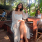 Model in a trendy evening maxi dress showcasing a stylish bohemian look outdoors