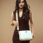Elegant model showcasing a trendy everyday sling bag from Stylera  against a neutral background