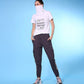 Stylera trendy fashion joggers with pockets styled with a graphic t-shirt and sporty shoes