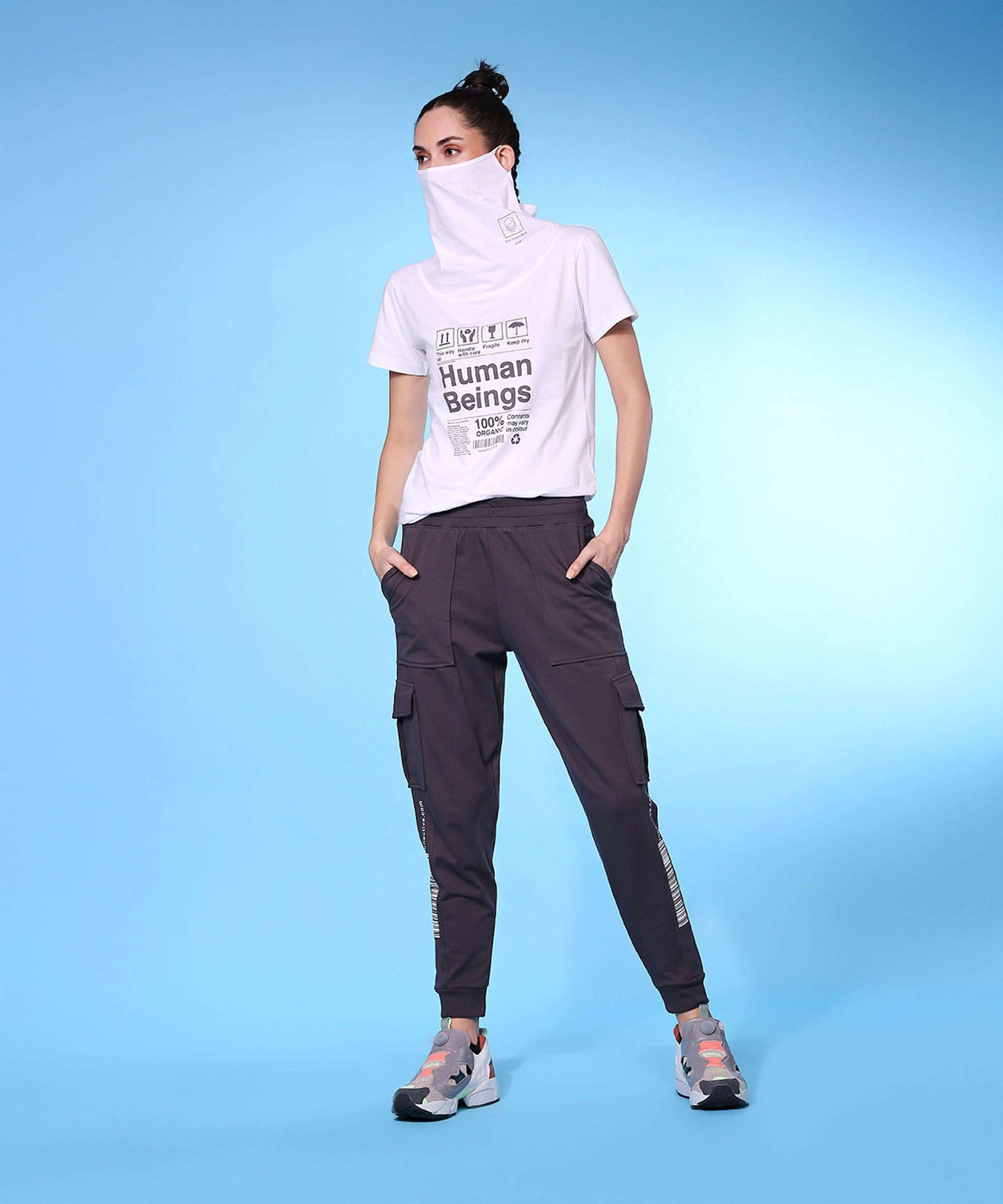 Stylera trendy fashion joggers with pockets styled with a graphic t-shirt and sporty shoes