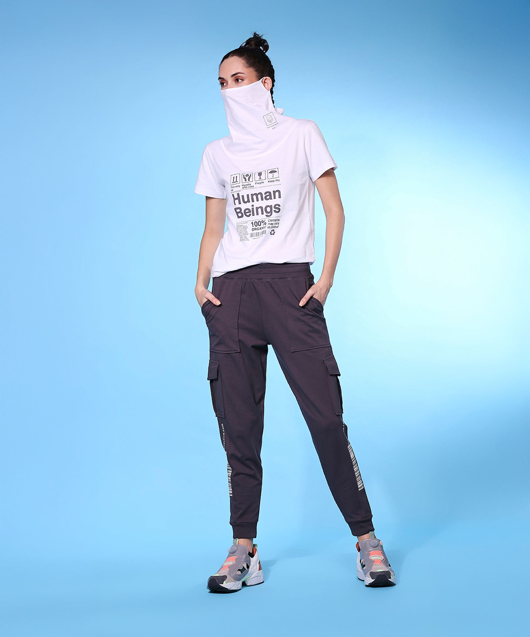 Stylera trendy fashion joggers with pockets styled with a graphic t-shirt and sporty shoes