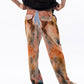 Stylera trendy fire design pants with a unique colorful pattern and relaxed fit for casual wear.