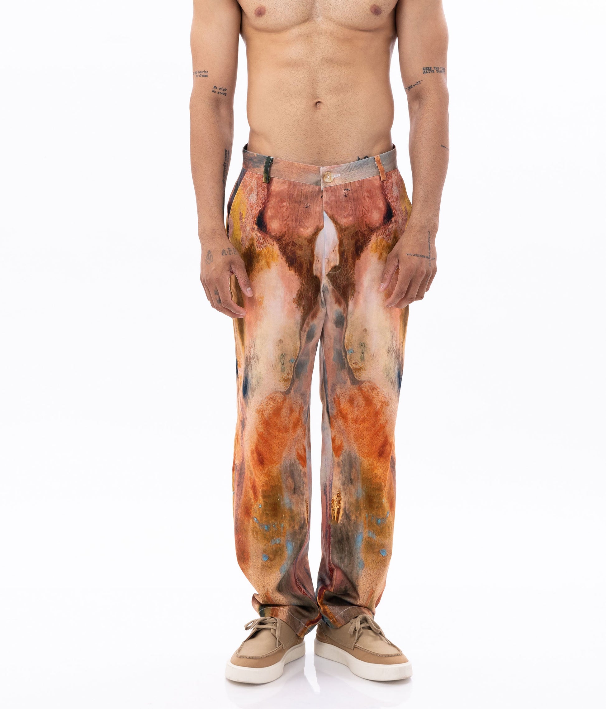 Stylera trendy fire design pants featuring a vibrant, abstract pattern in warm colors