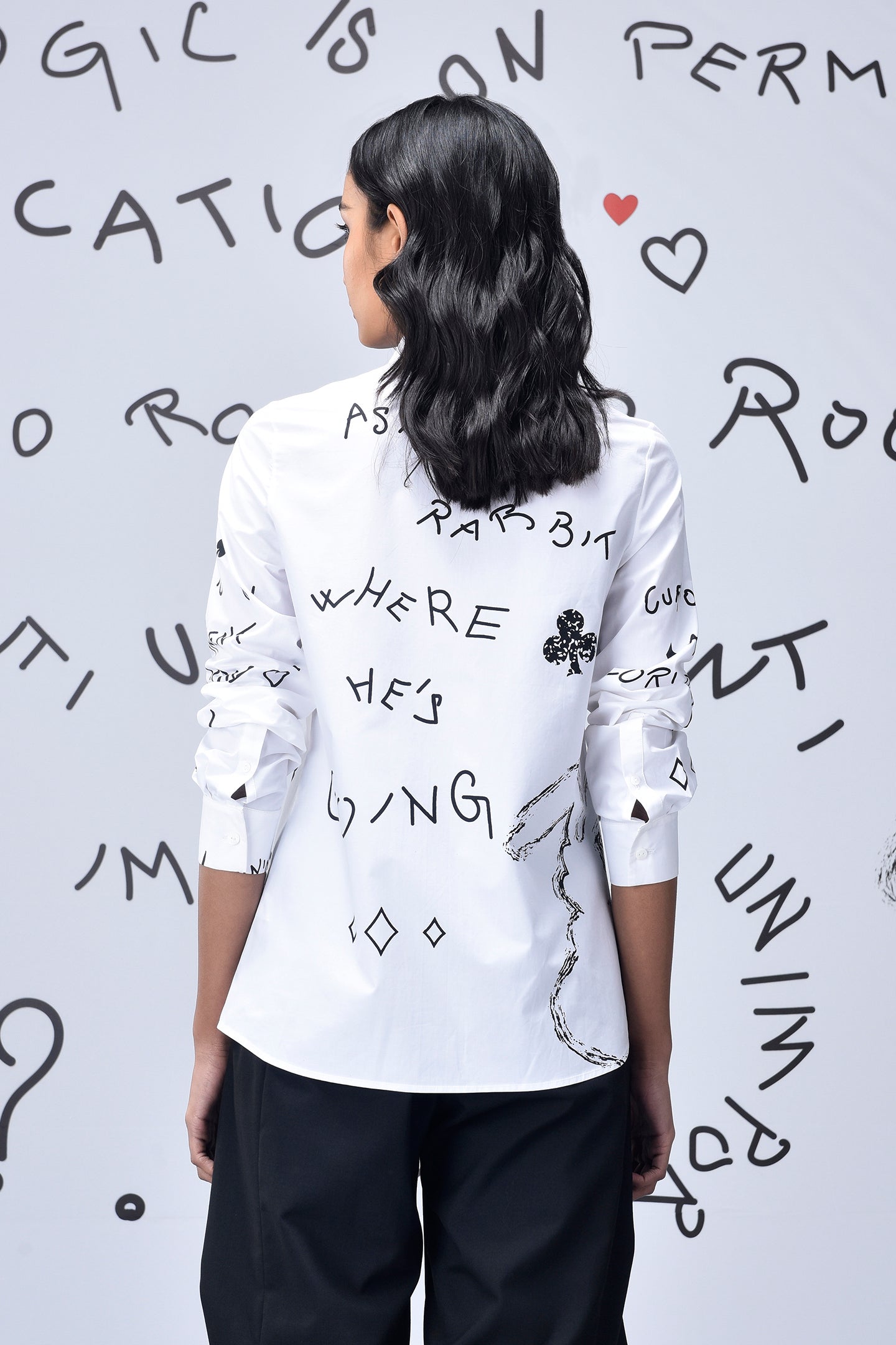 Stylera white shirt with handwritten black graphics and clover motif back view trendy graphic shirts for women