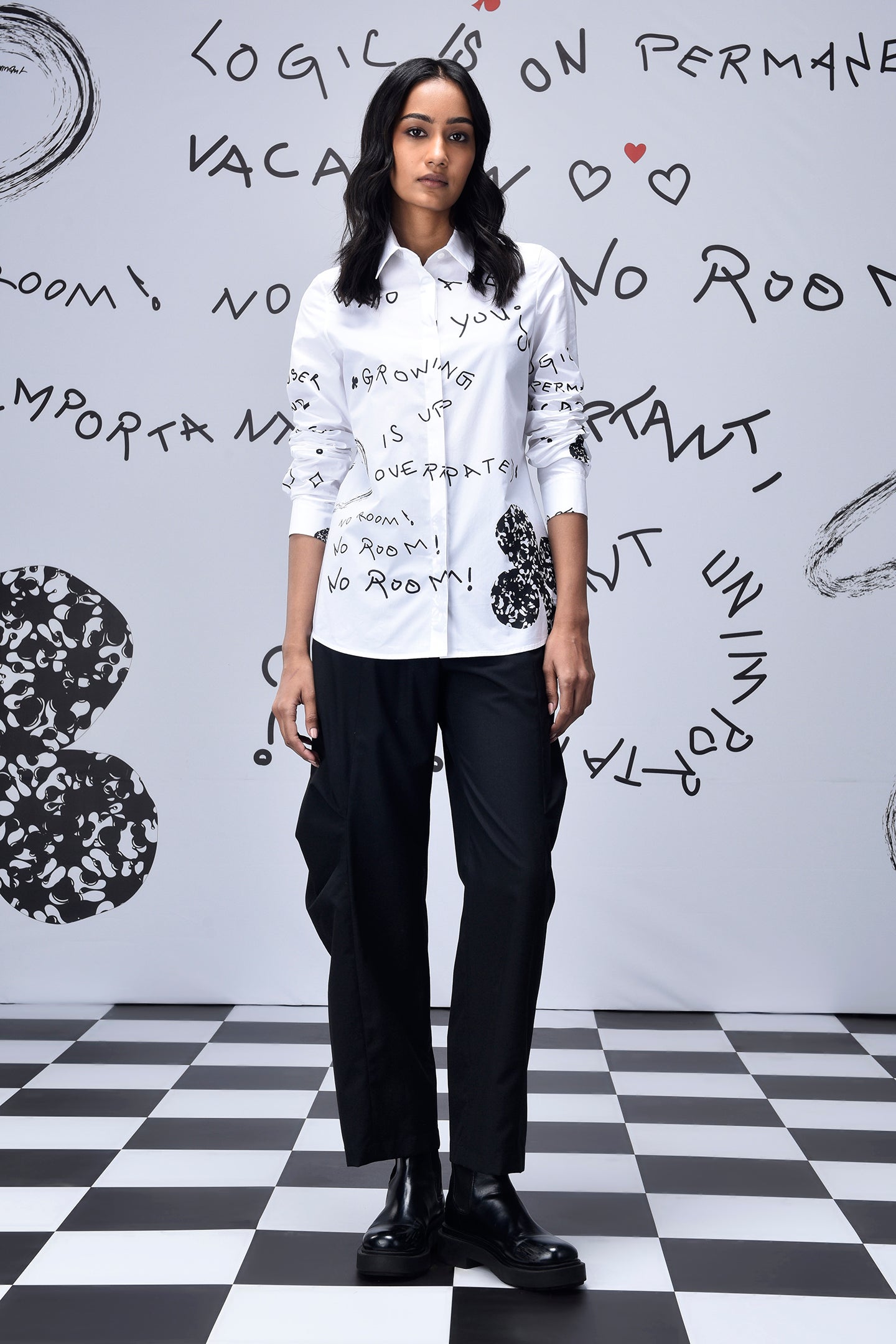 Stylera white button up shirt with black handwritten print on model trendy graphic shirts for women