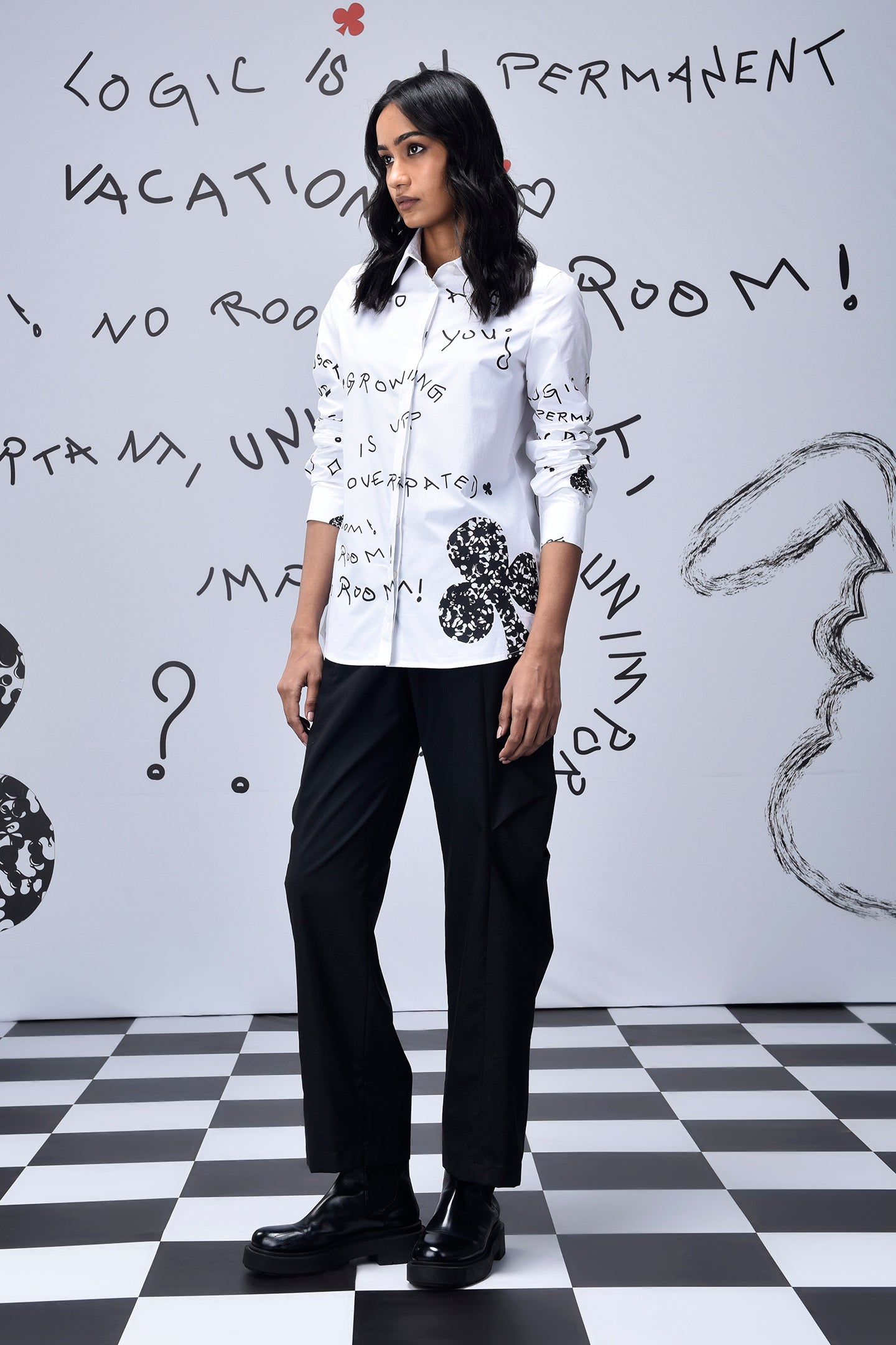 Stylera white button down shirt with black graffiti doodles on model trendy graphic shirts for women