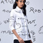 Stylera white button down shirt with black doodle print on model trendy graphic shirts for women