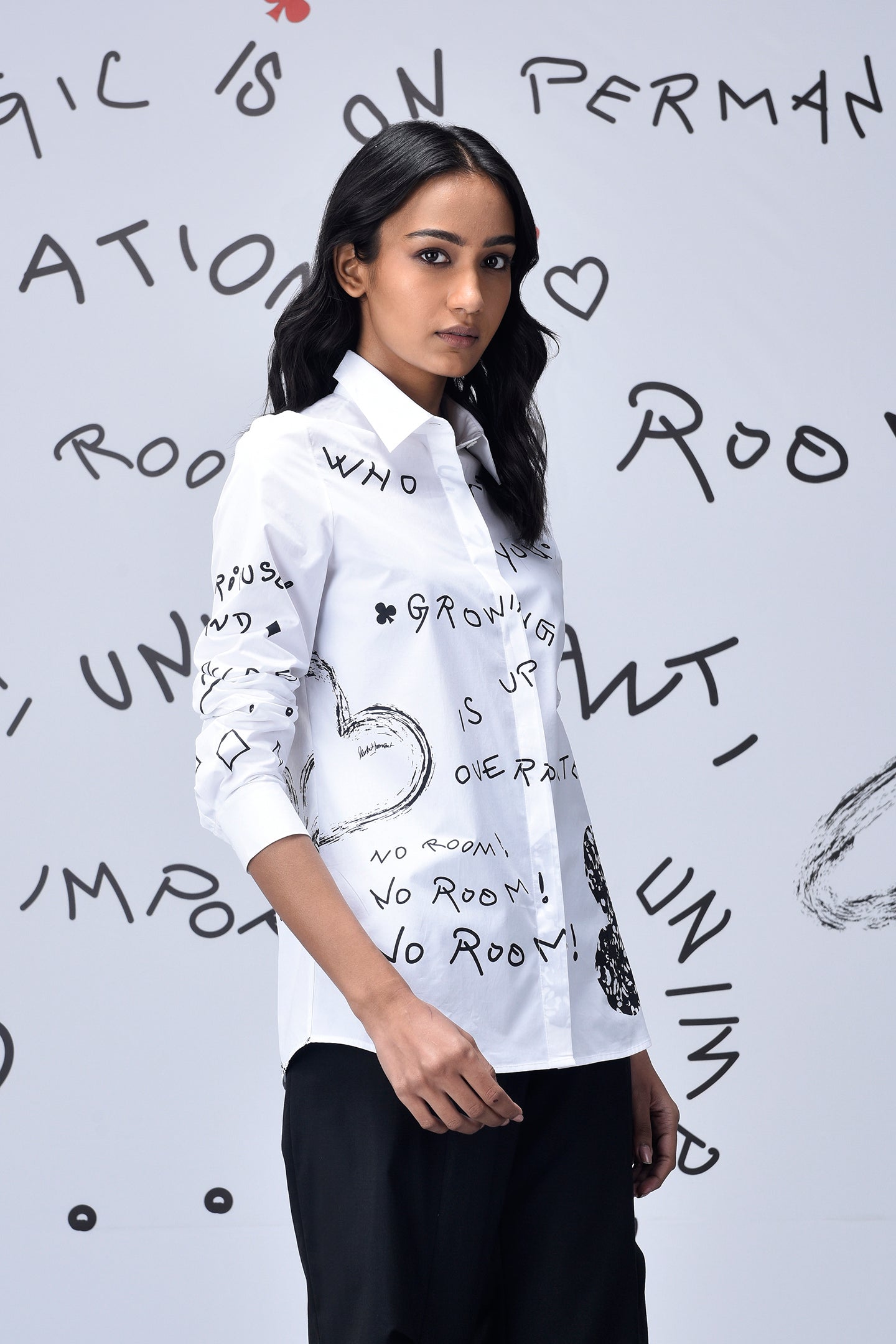 Stylera white button down shirt with black doodle print on model trendy graphic shirts for women