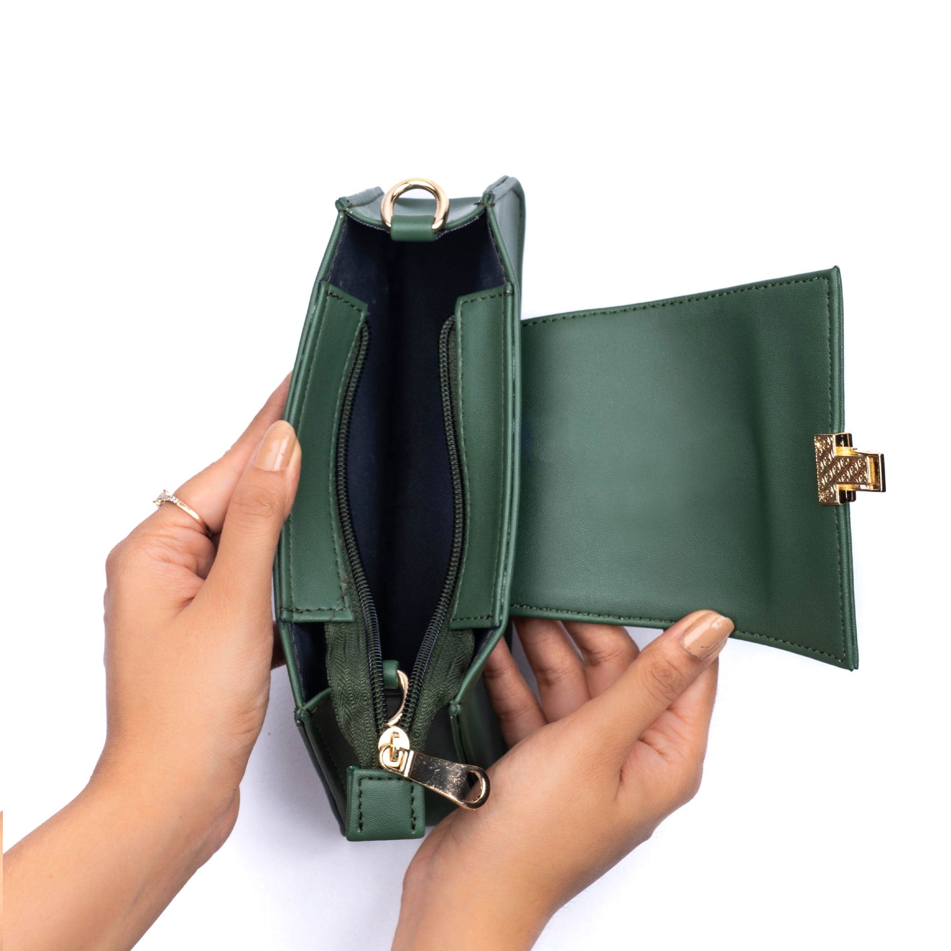 Stylish mini baguette bag in green showcasing interior with zipper, a trendy green handbag by Stylera